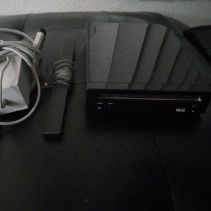 Wii System Console, all cords and wii sensor bar.